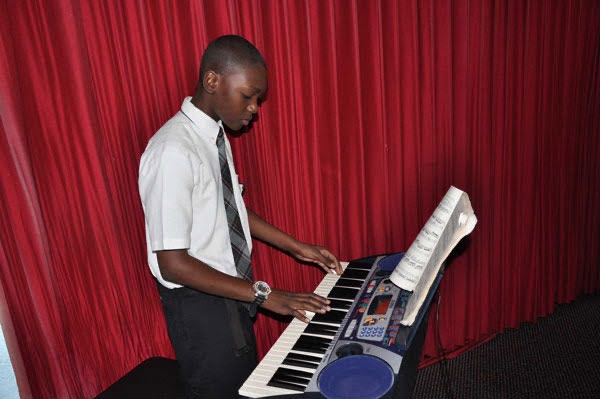 Caption: Elijah Stevens started playing piano in church at the age of 11.