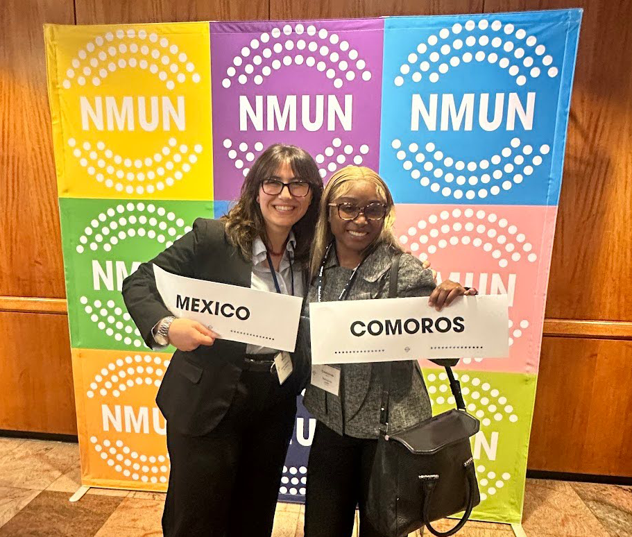 Junior political science major Mahogany Jules (right) poses with a student from the Mexican delegation at the National Model UN conference.